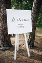 Elegant easel welcoming guests to wedding