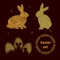 Elegant Easter set of gold bunny and eggs on black.