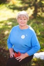 Elegant elderly woman portrait, autumn day. Royalty Free Stock Photo