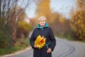 Elegant elderly woman portrait, autumn day. Royalty Free Stock Photo