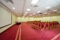 Elegant empty conference hall with a red carpet on Royalty Free Stock Photo