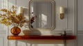 An elegant entryway console table with an orange glass top, adorned with a large mirror Royalty Free Stock Photo