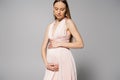 Elegant and fair haired expecting mother Royalty Free Stock Photo