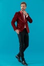 Elegant fashion man wearing red velvet tuxedo Royalty Free Stock Photo