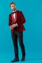 Elegant fashion man wearing red velvet tuxedo Royalty Free Stock Photo