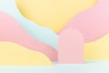 Elegant fashion style paper abstract stage mockup with pink arch podium, pastel mountain landscape - yellow, mint color slopes.