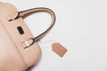 Elegant fashionable formal beige leather handbag for business woman on white background, trendy minimalistic luxury style with