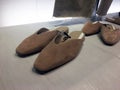 Elegant fashionable summer brown stylish mule shoes on shelf in shoes store. Mass market shop. Wedge Mules. Close View Of Fashion