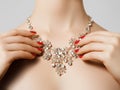 Elegant fashionable woman with jewelry. Beautiful woman with diamond necklace. Young beauty model with manicured nails