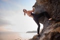 Elegant female extreme climber looking in camera Royalty Free Stock Photo