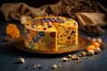 elegant festive fruit cake with candied fruits and pieces of dried berries