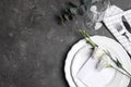 Elegant festive table setting on grey background, flat lay. Space for text Royalty Free Stock Photo