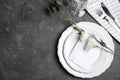 Elegant festive table setting on grey background, flat lay. Space for text Royalty Free Stock Photo