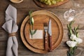 Elegant festive table setting on wooden background