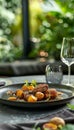 Elegant fine dining presentation of confit de canard with saut ed potatoes on a modern slate table Royalty Free Stock Photo
