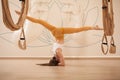 Young fit woman exercising at yoga studio