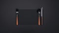 Elegant flatware arrangement on dark background with copy space Royalty Free Stock Photo