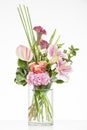 Elegant flower arrangement in beautiful vase isolated in a bright white studio Royalty Free Stock Photo