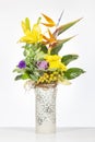 Elegant flower arrangement in beautiful vase isolated in a bright white studio Royalty Free Stock Photo