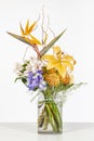 Elegant flower arrangement in beautiful vase isolated in a bright white studio