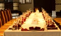 Elegant formal table set with red linen accents