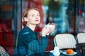 Elegant French woman in Parisian cafe Royalty Free Stock Photo