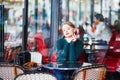 Elegant French woman in Parisian cafe Royalty Free Stock Photo