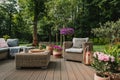 Elegant garden furniture on terrace of suburban home Royalty Free Stock Photo