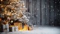 Elegant gift boxes, candles and a white Christmas tree decorated with ornaments on snow against an unfocused wooden background Royalty Free Stock Photo