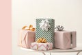 Elegant gift boxes on table against color background Royalty Free Stock Photo
