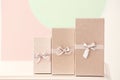 Elegant gift boxes on table against color background Royalty Free Stock Photo