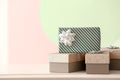 Elegant gift boxes on table against color background Royalty Free Stock Photo