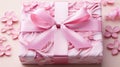 Elegant gift packaging with large bow on draped background in light pink tones, top view Royalty Free Stock Photo