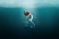 Dancer underwater in a state of peaceful levitation