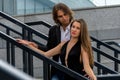 Elegant glamorous couple hugs at the granite steps