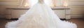 Elegant and glamorous white bridal dresses hanging on hangers in a luxurious boutique salon