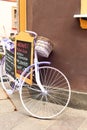 Elegant glamour purple retro bicycle - menu. Outdoors.