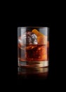 elegant glass of Bourbon Old Fashioned, on black background