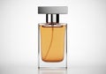 Elegant glass perfume bottle with amber liquid and silver cap Royalty Free Stock Photo