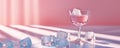 Elegant glass with a pink drink and ice cubes on a table Royalty Free Stock Photo