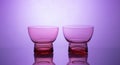 Elegant glassware displayed on mesmerizing glowing gradient background Royalty Free Stock Photo