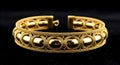 AI-generated Elegant Gold Bracelet on Black Background Close-Up Royalty Free Stock Photo