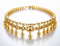 Elegant Gold Necklace with Dangling Spheres on a White Reflective Surface Royalty Free Stock Photo