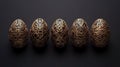 Elegant gold patterned Easter eggs on black background, holiday design Royalty Free Stock Photo