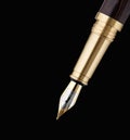 Elegant gold plated business fountain pen isolated on black Royalty Free Stock Photo