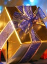 Elegant gold present with blue ribbon Royalty Free Stock Photo