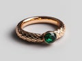 Elegant gold ring with emerald gemstone on white background. Royalty Free Stock Photo