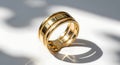 Elegant gold ring with shadow play and sunlight Royalty Free Stock Photo