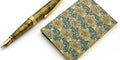 Elegant Gold and Teal Patterned Notepad with Luxury Fountain Pen Royalty Free Stock Photo