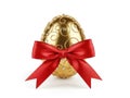 Elegant golden easter egg with red bow Royalty Free Stock Photo